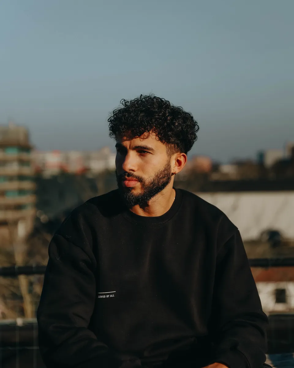 Jurgen Booi on a rooftop at golden hour